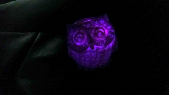 The purple owlantern in the dark